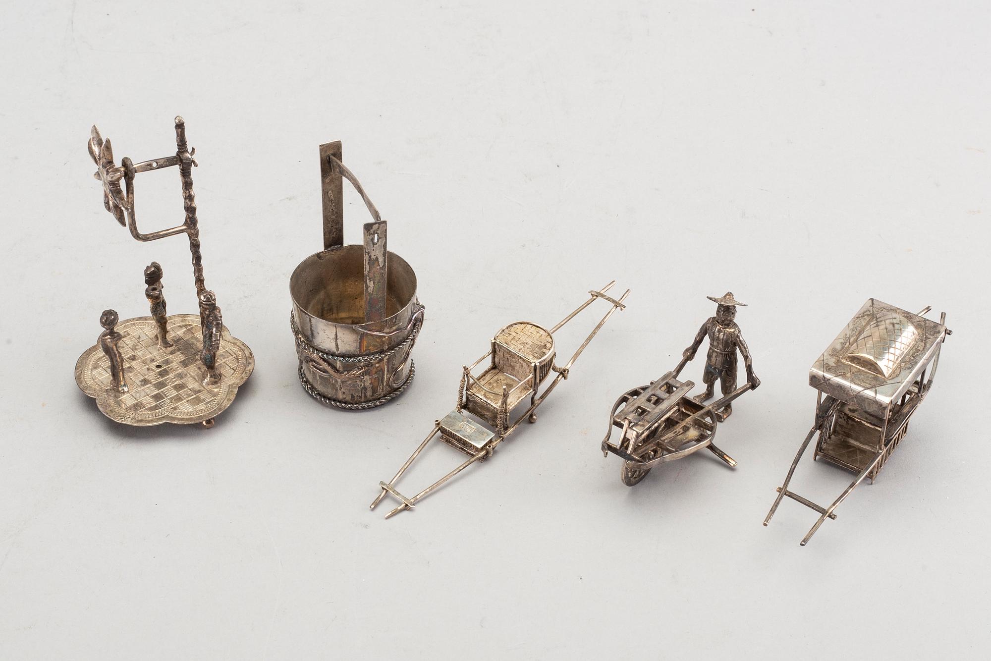 A set of five Chinese silver figurines.