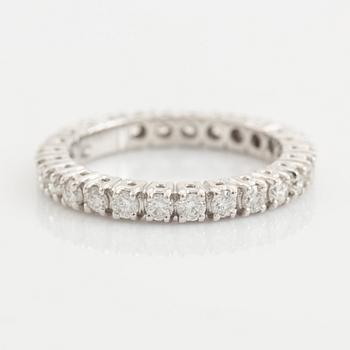 Brilliant cut diamond eternity ring.