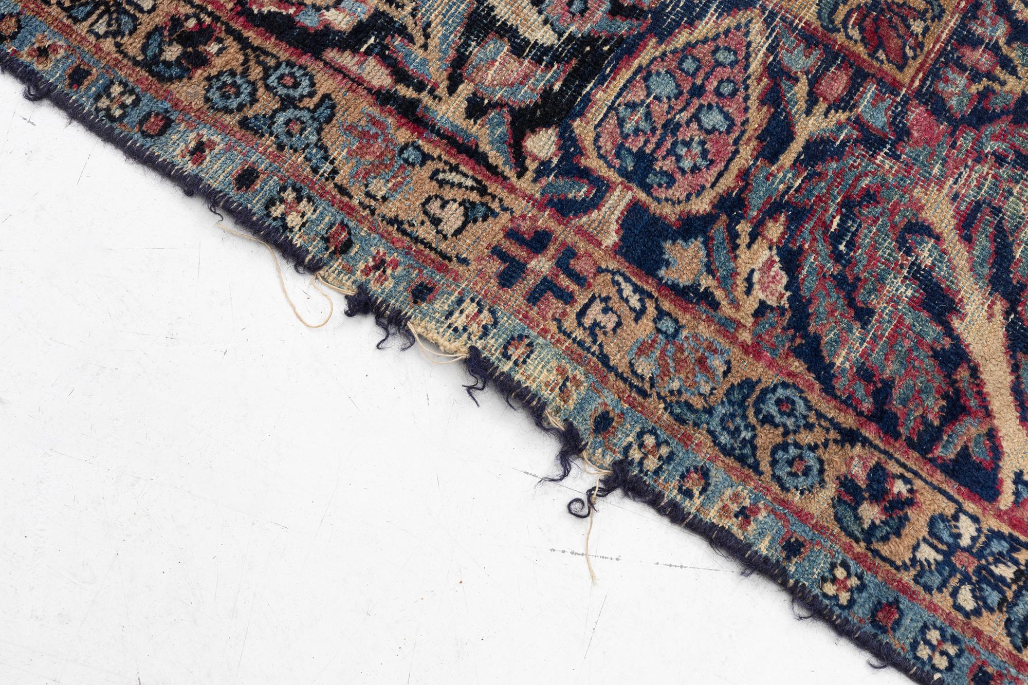 A semi-antique Kerman carpet, c. 325 x 203 cm.