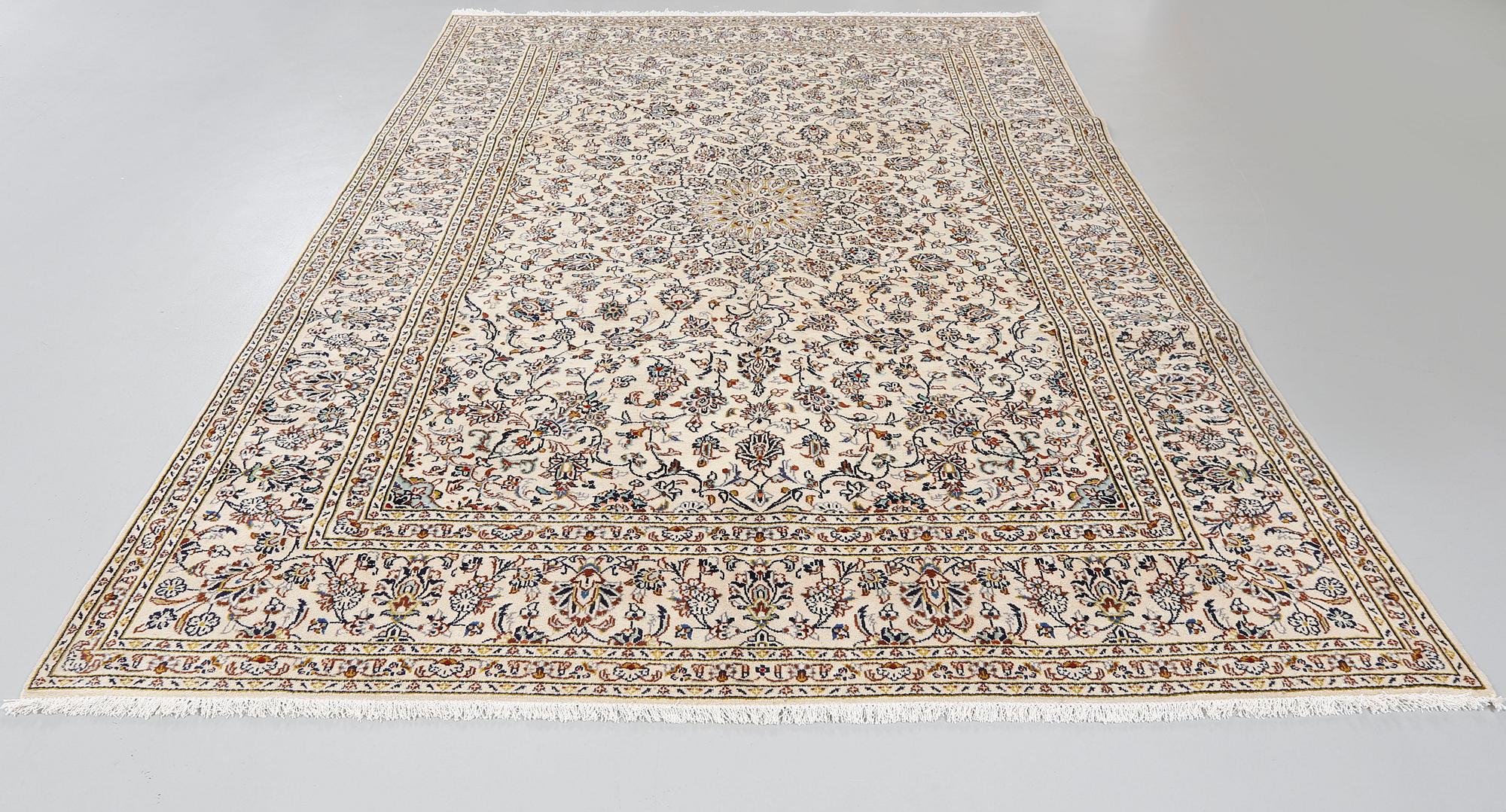 A Keshan rug, 340 x 236 cm.