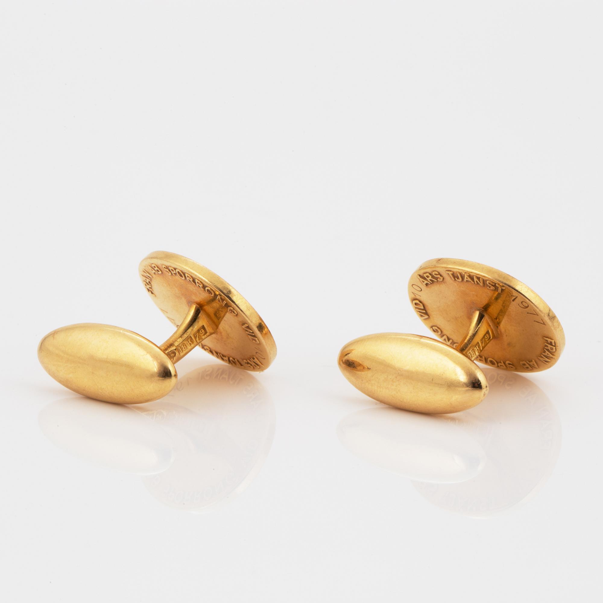 MANSCHETTKNAPPAR, Sporrong, 18K guld.