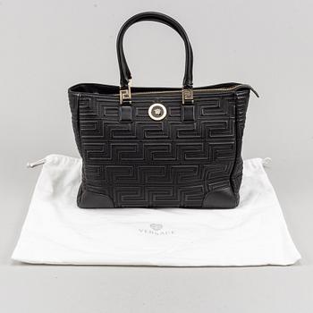 Versace, a black quilted leather handbag.