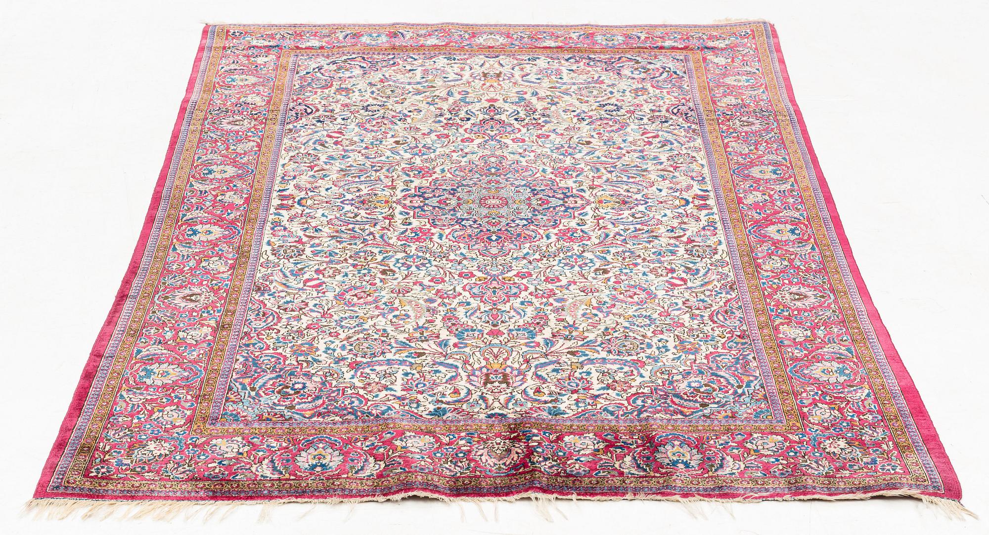 An antique silk Kashan rug, ca ca 200 x 124 cm.
