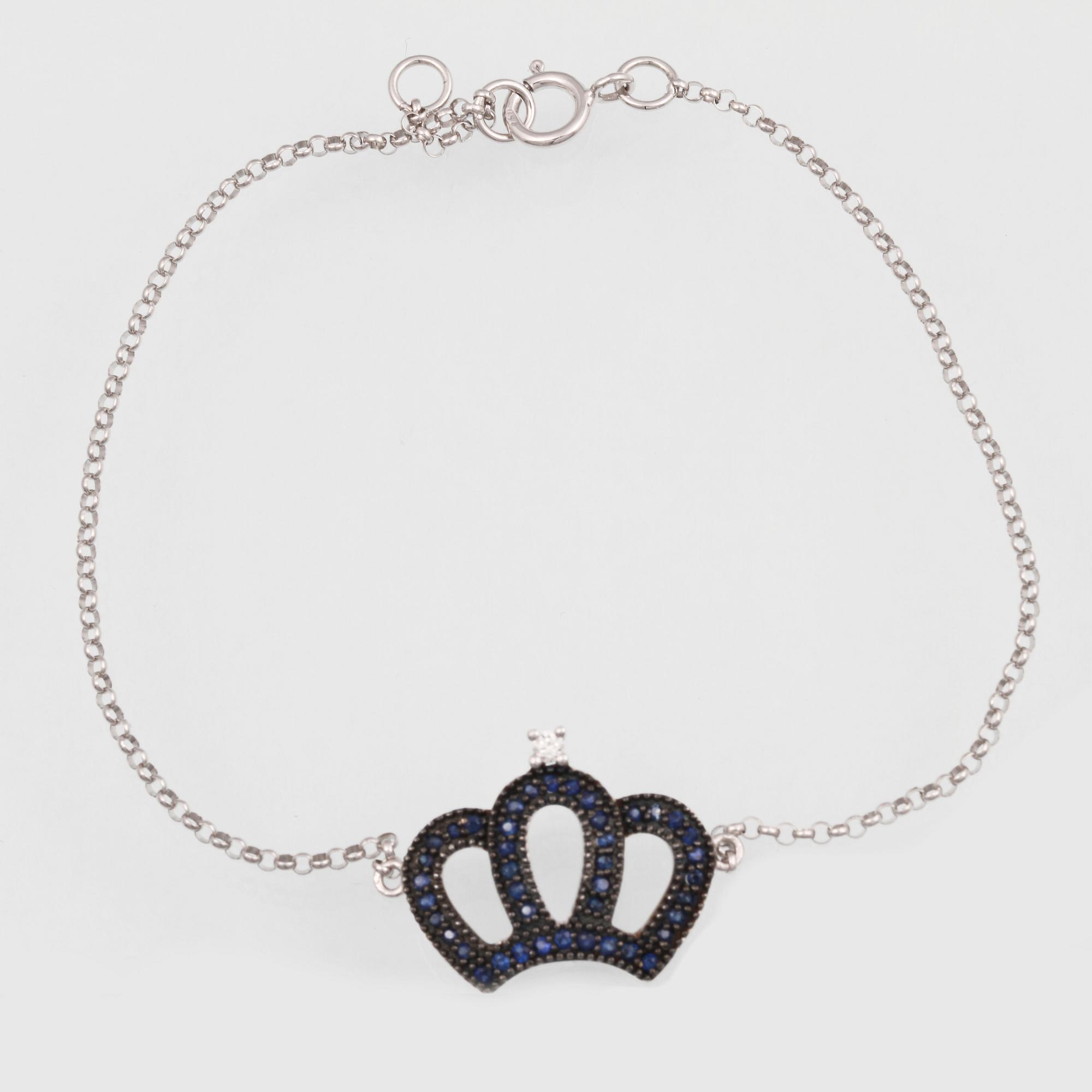 ARMBAND, 18K vitguld med briljantslipad diamant ca 0.02 ct samt fasettslipade safirer ca 0.19 ct. Vikt 1,8 gram.