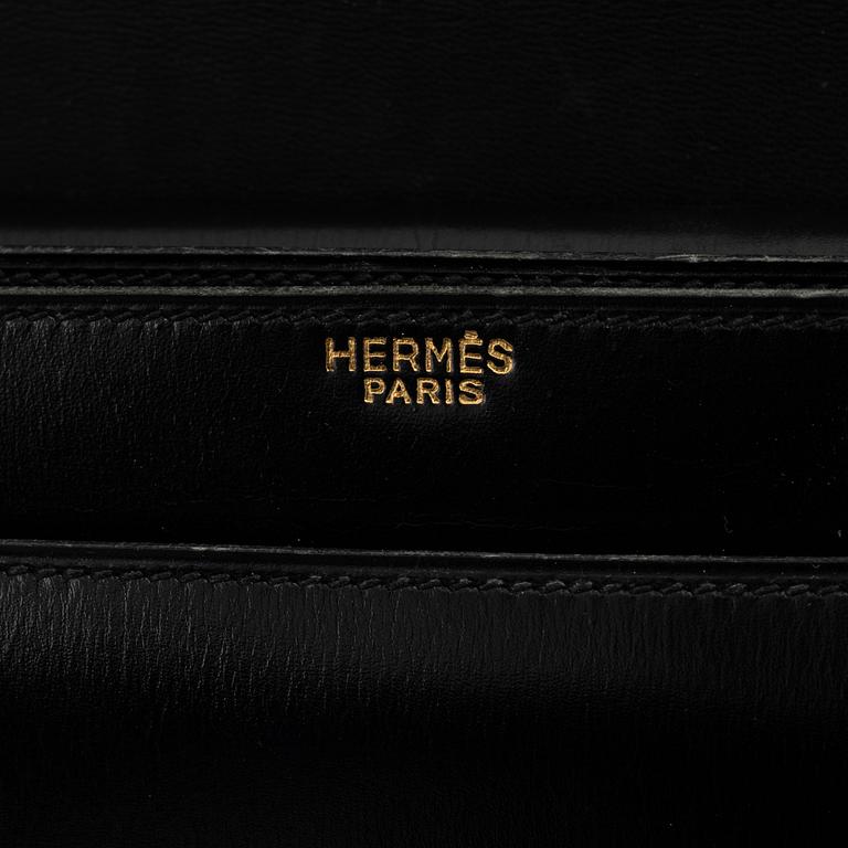 Hermès, a black leather 'Boutonniere' bag, 1960's.