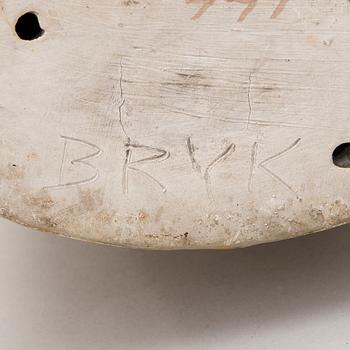 A stoneware figurine signed BRYK.