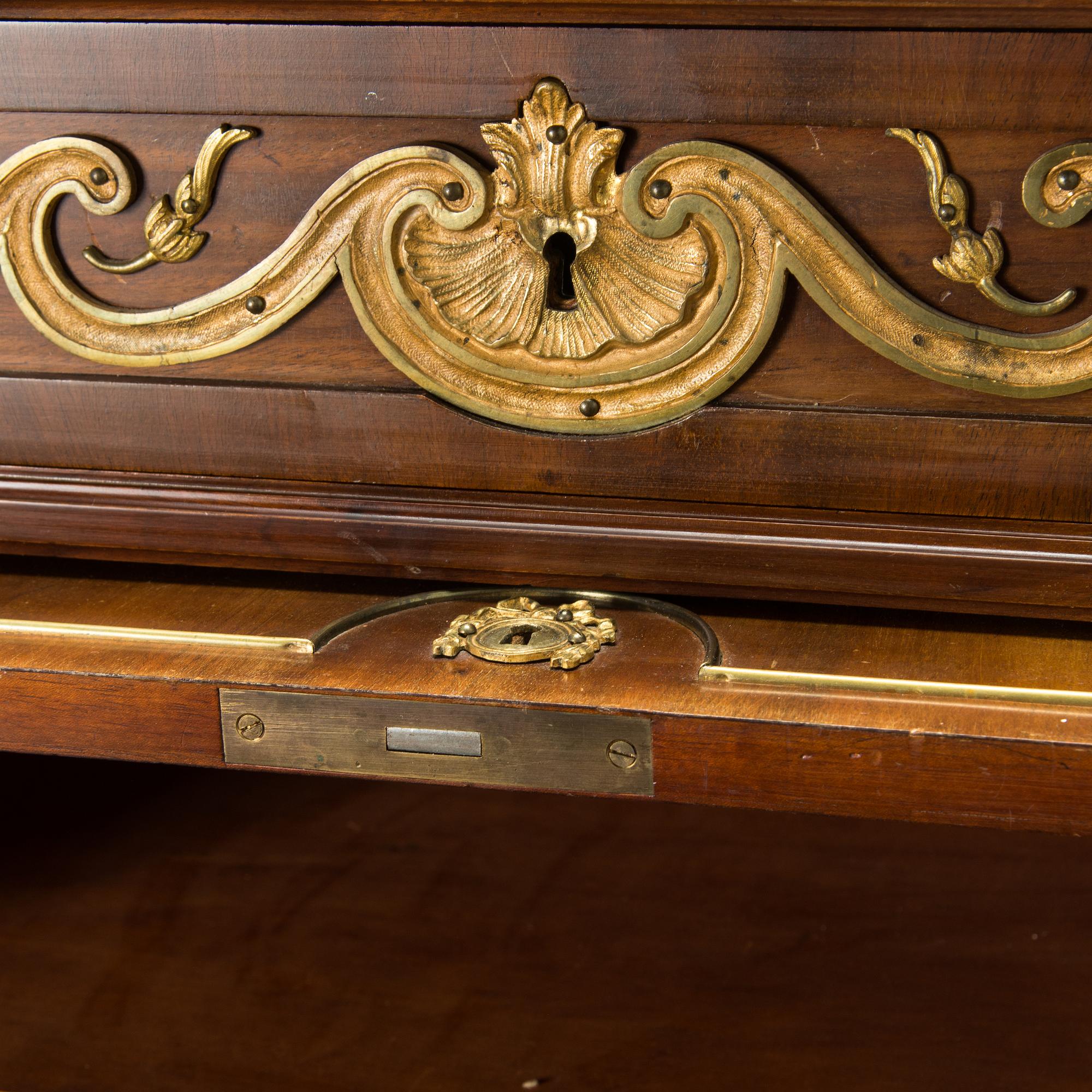 A 20th-century Louis XVI style mahogany veneered writing desk.