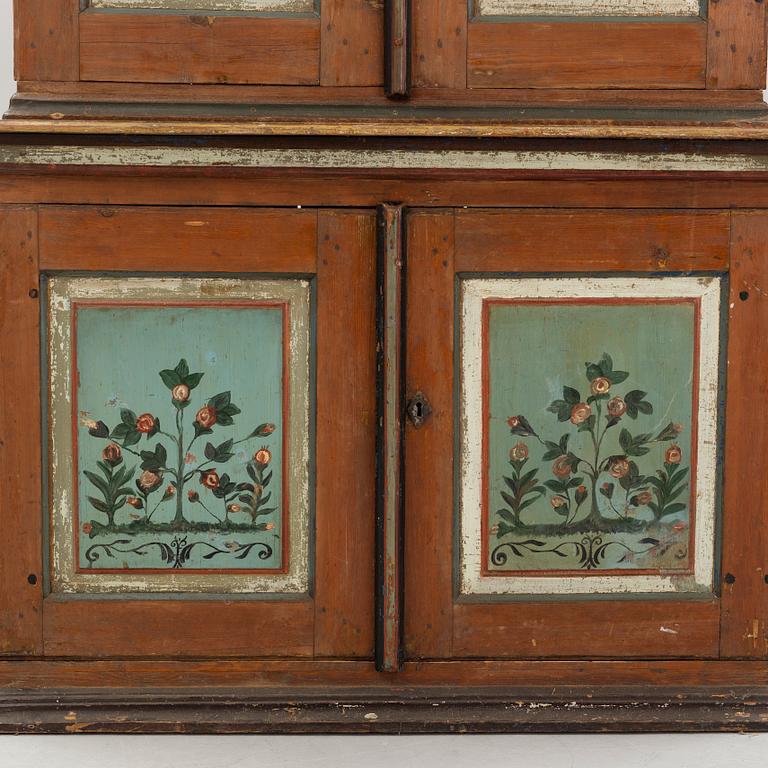 A Swedish polychrome.-painted cabinet, presumably from Halland, dated 1805.