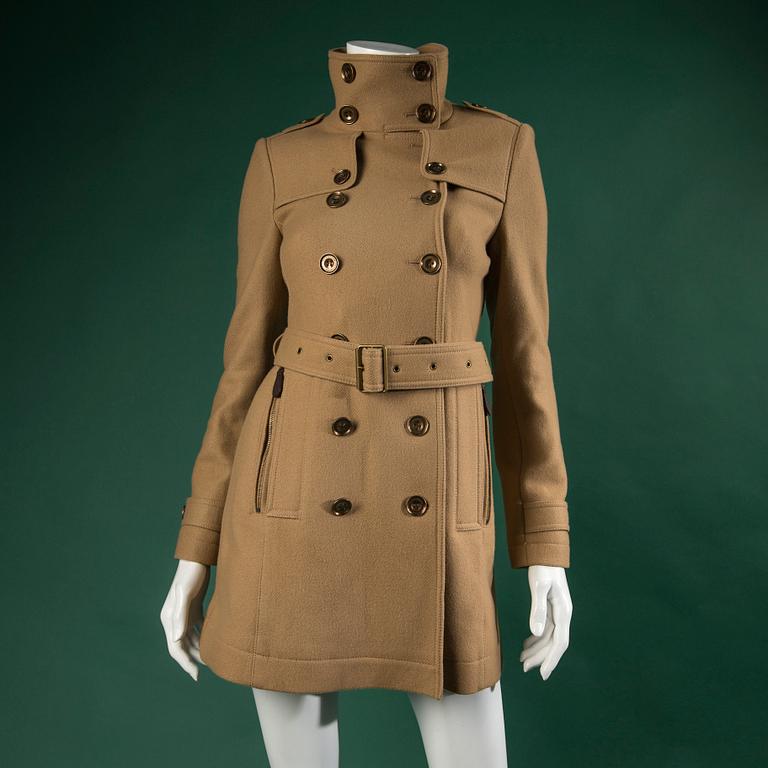 A TRENCHCOAT by BURBERRY.