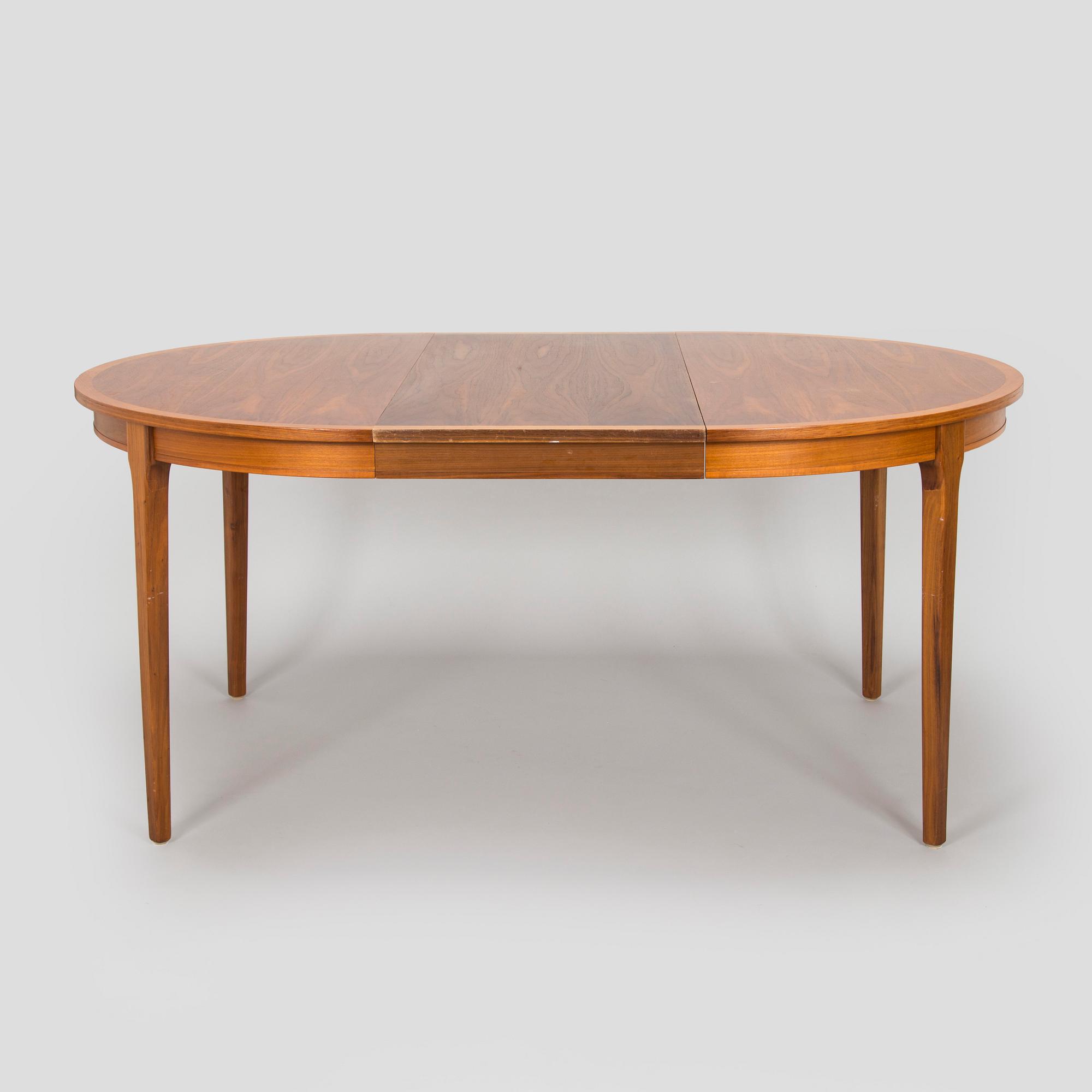 A 1960s teak and oak dining table.