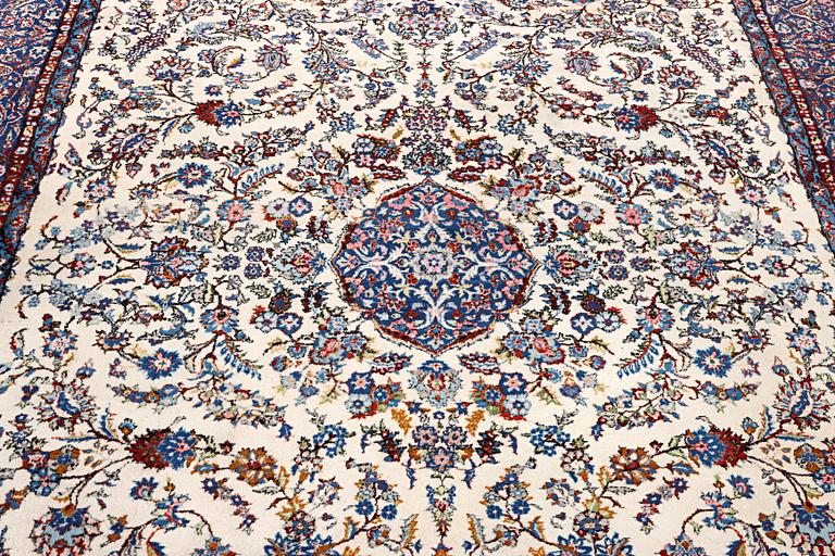 An oriental carpet, c. 308 x 220 cm.