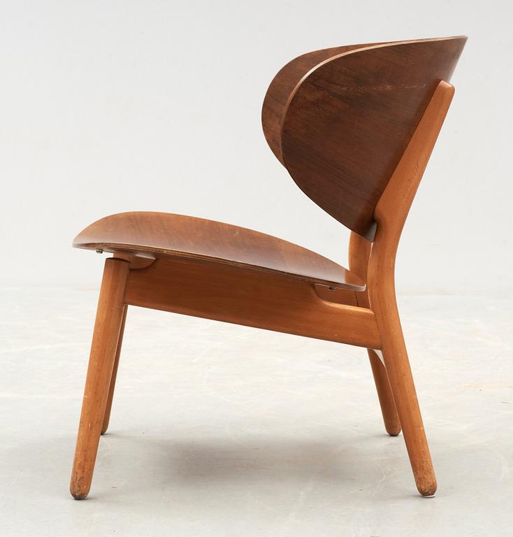 A Hans J Wegner mahogany and beech easy chair, Denmark 1950's.