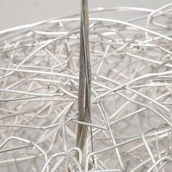 A 'Fil de Fer Ovale' ceiling light by Enzo Cattelini.