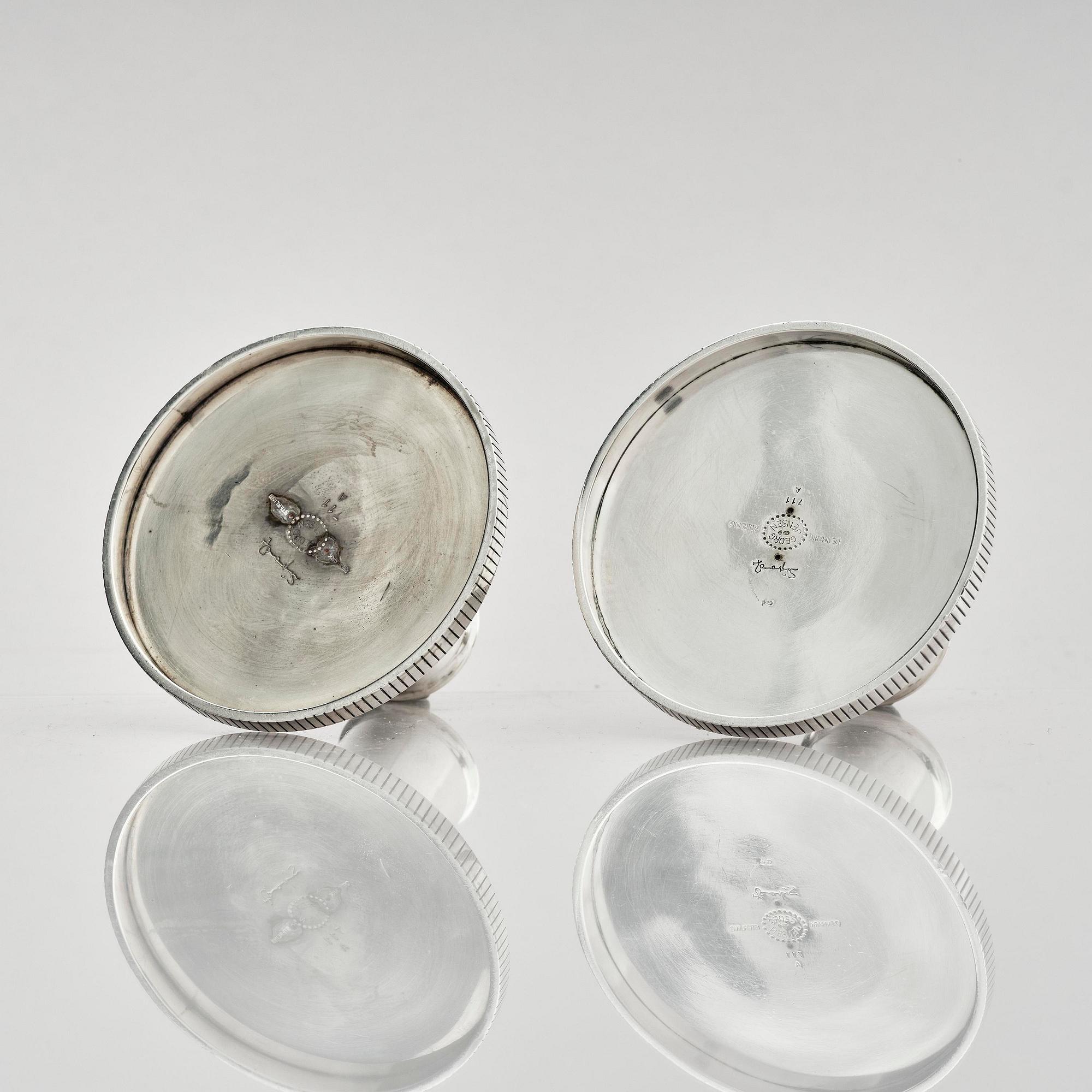 Georg Jensen, a pair of sterling silver candlesticks, design by Sigvard Bernadotte, model no 711A, Copenhagen, Denm after 1945.