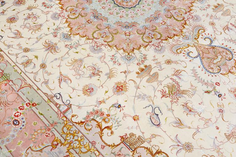 A signed Tabriz carpet, partly silk, so called 60 Raj, c 358 x 246 cm.