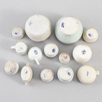 Fourteen miniature ceramic vases, south east asia, presumably 17th century.