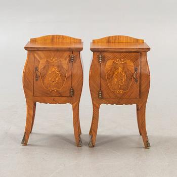 A pair of Baroque style mahogany bedside tables first half of the 20th century.