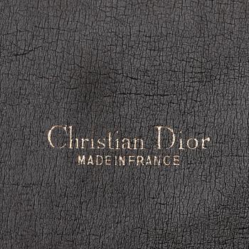 A brown monogram canvas handbag and keyholder by Christian Dior.