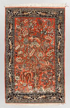 An oriental silk rug, around 169 x 108 cm.