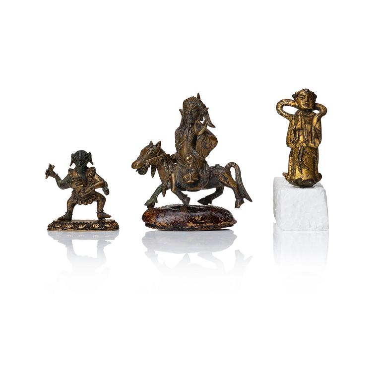 A group of three bronze miniatures sculptures of deities, China and Tibet, 18th Century.