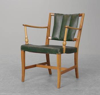 A Josef Frank mahogany and green leather easy chair, Firma Svenskt Tenn.