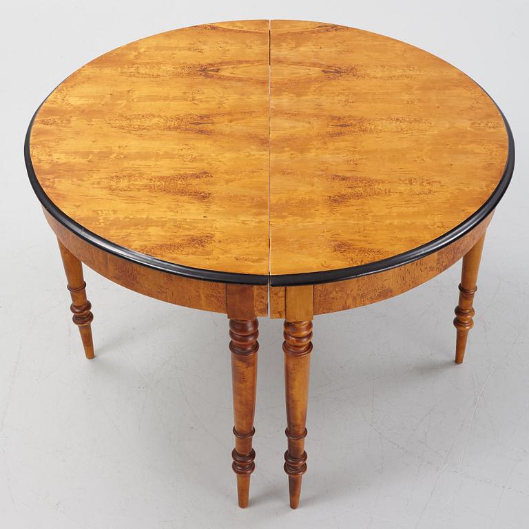 A birch veneered dining table, second half of the 19th Century.