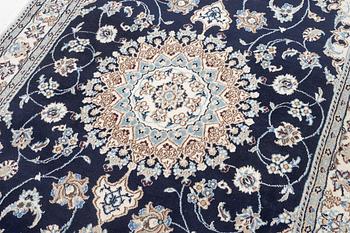 A Nain carpet, c. 255 x 150 cm.