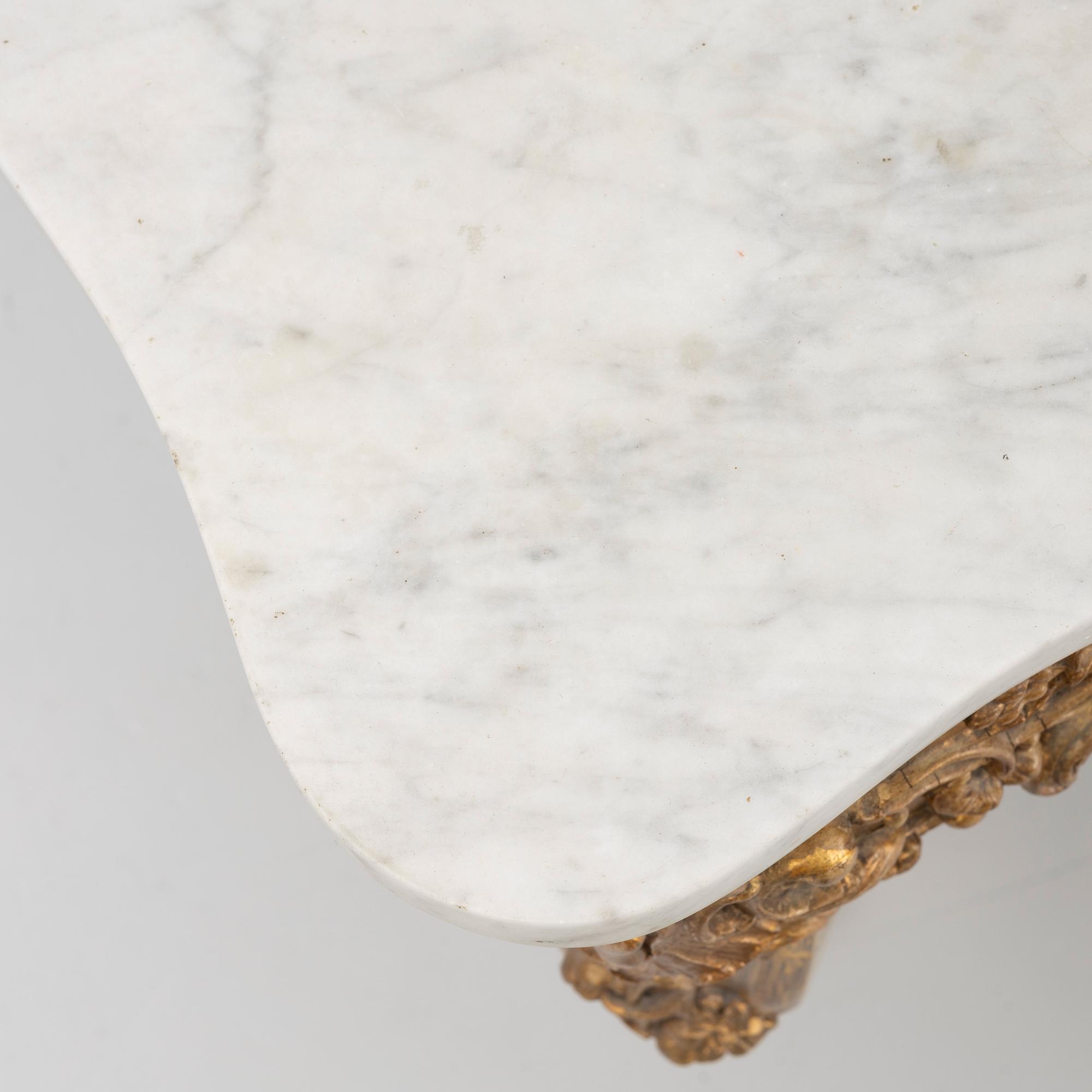 A Rococo style console table, late 19th Century.