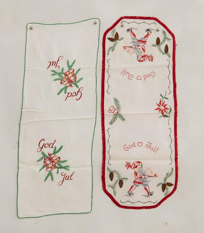 A collection of smaller Christmas tablecloths, runners, and wall hangings, approximately 34 pieces, mid/second half of the 20th century.