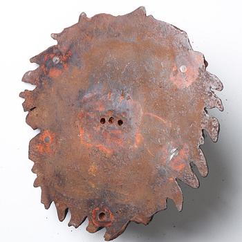 Anna Petrus, a cast iron mascaron in the shape of a lion's head.