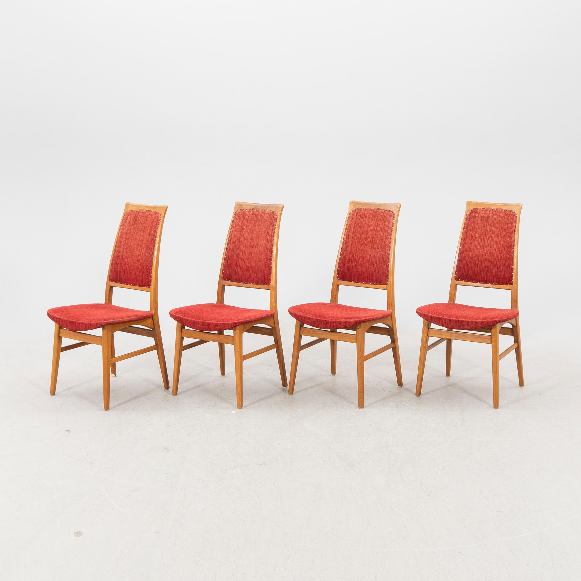 A set of four  mid 1900s teak chairs.