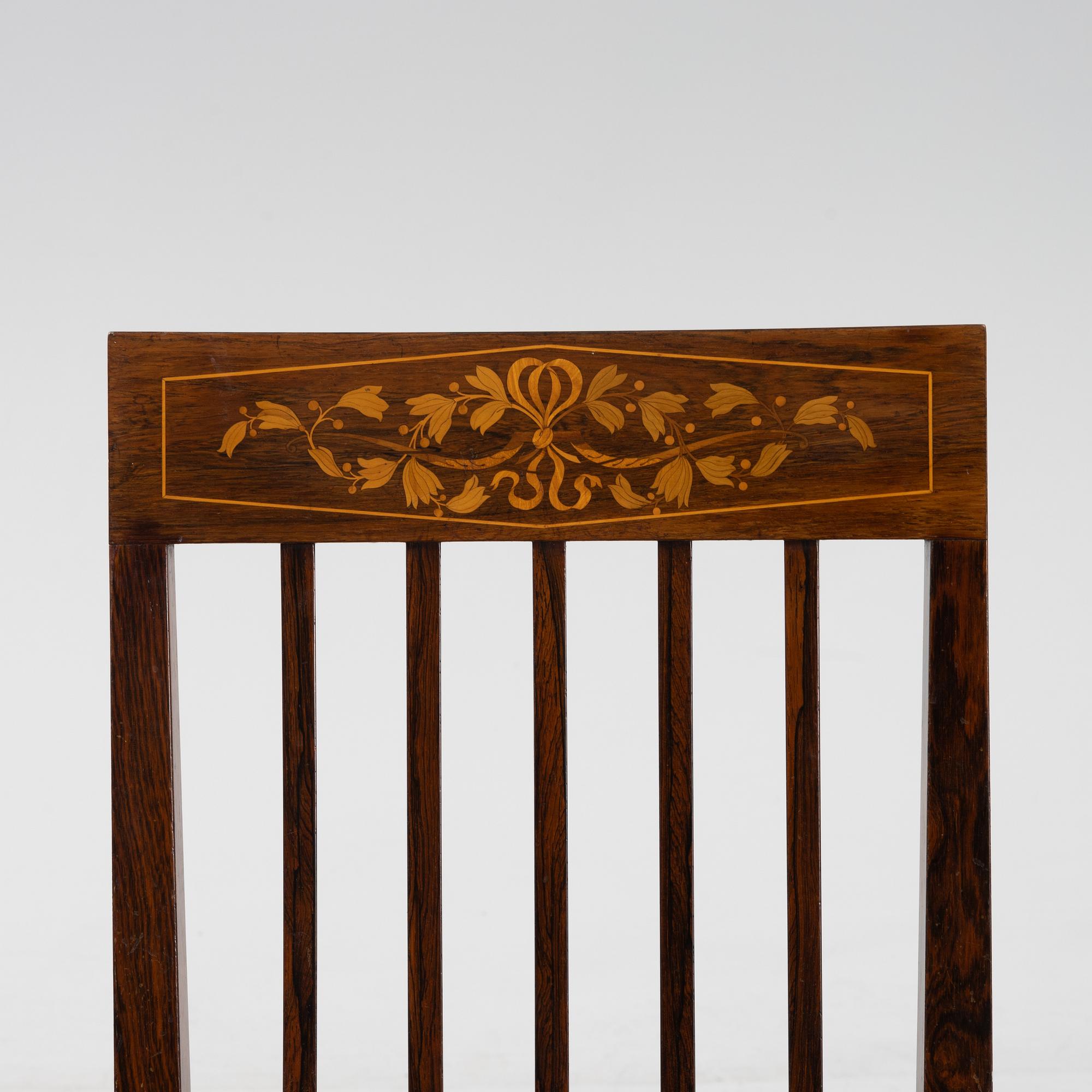A group of five rosewood veneered chairs and a stool, mid 20th Century.
