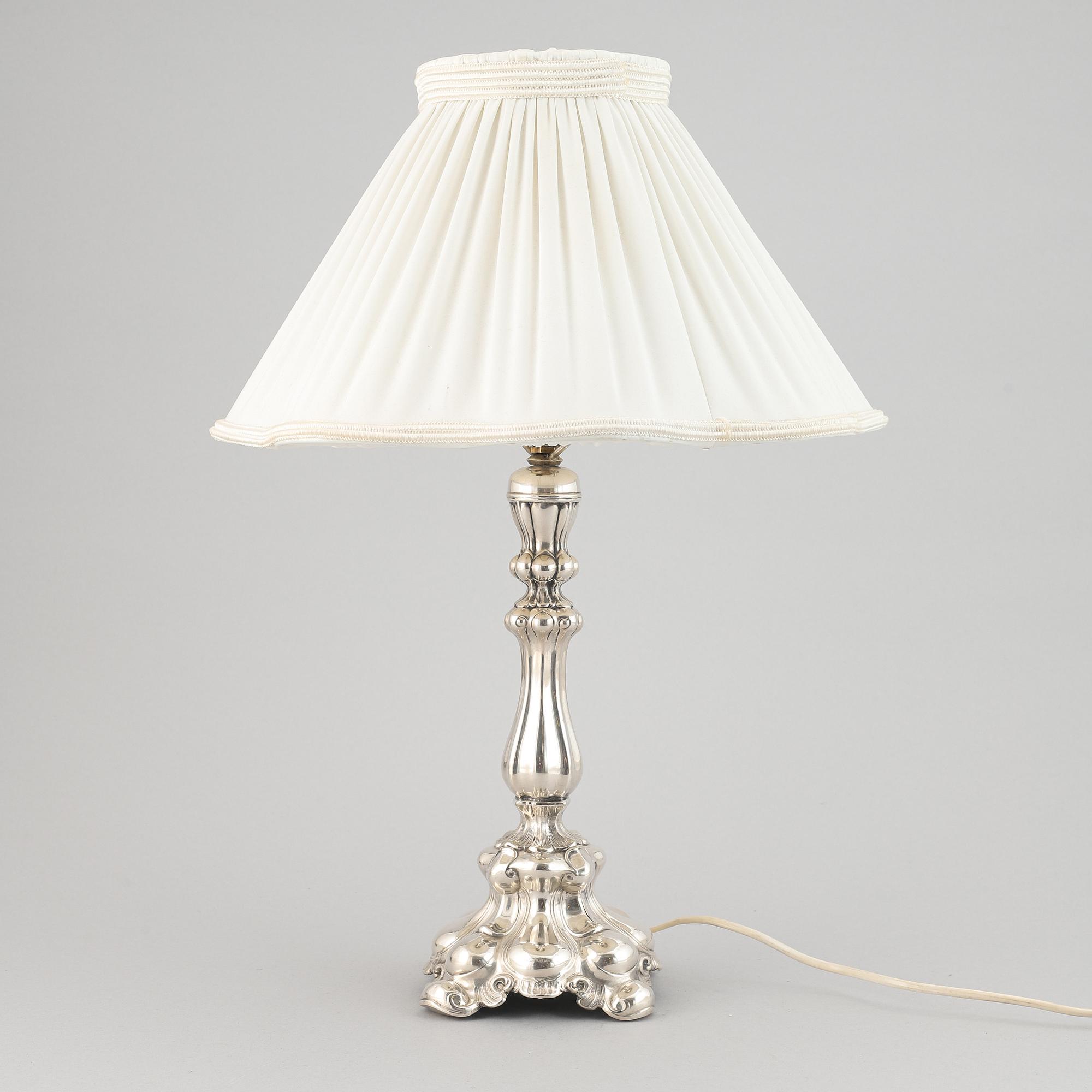 A silver plate neo-rococo tablelamp by CG Hallberg.