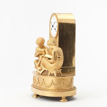 A French Empire early 19th century gilt bronze mantel clock.