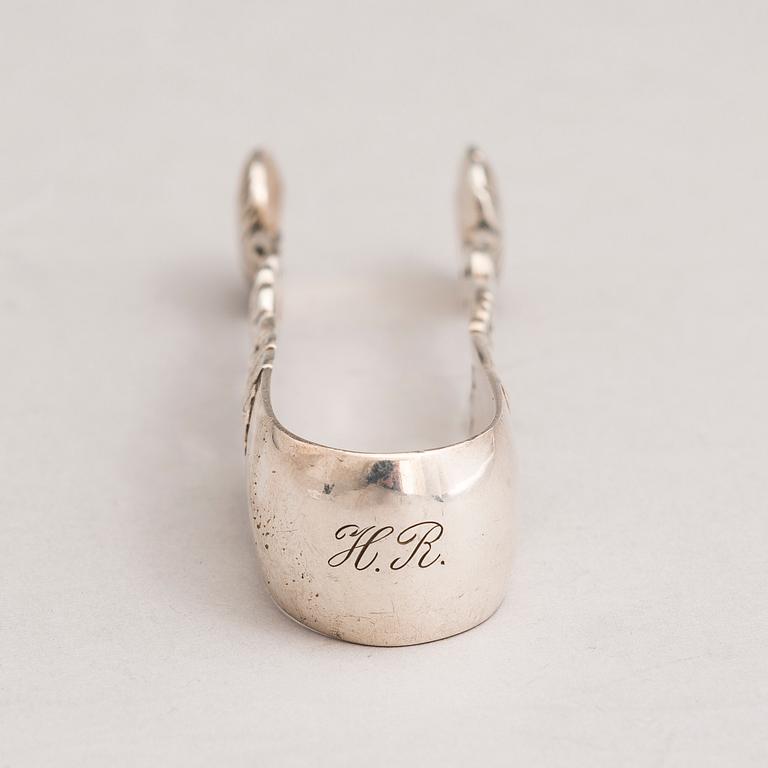 A silver sugar tong and a 3-piece silver coffee set, mark of Juho H. Pekuri, Oulu 1931 and Finnish import marks 1938.