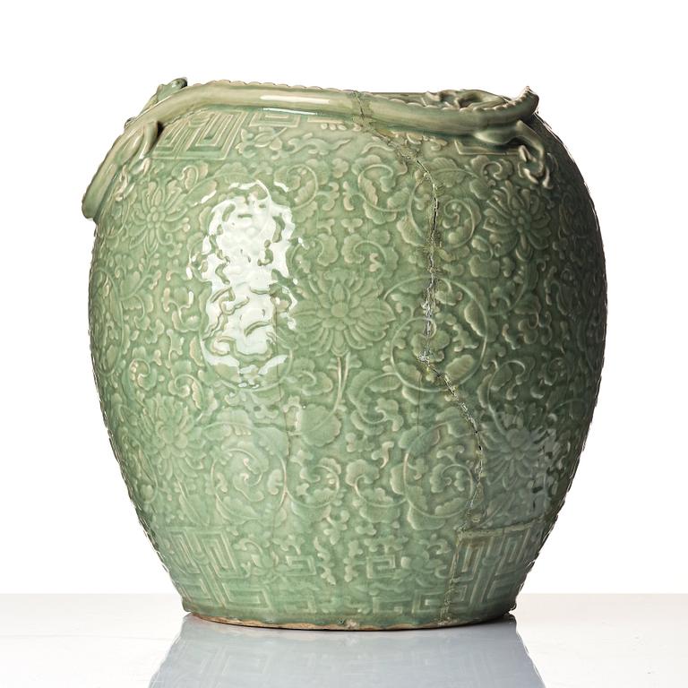 A large celadon 'lotus and qilong' vase, Qingdynasty, 19th century.