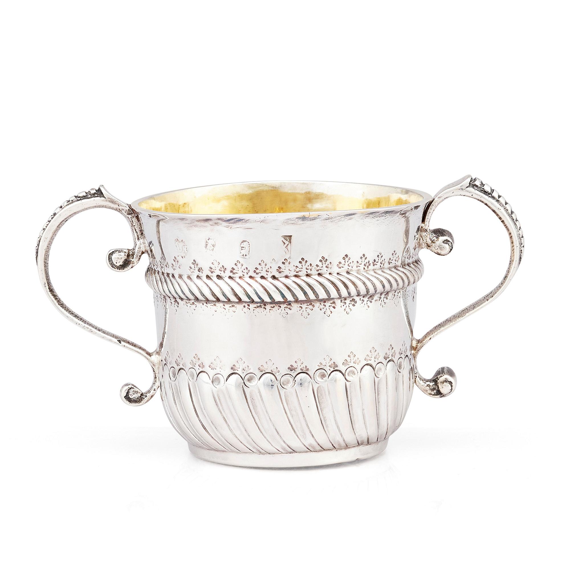 An English late 17th Century silver porringer, marks if William Andrews, London 1697-98.