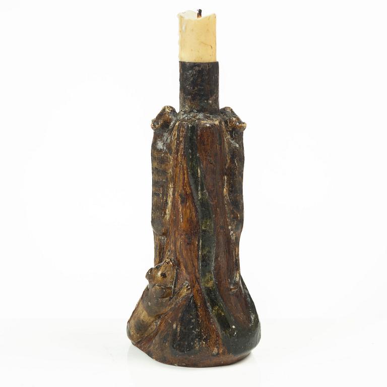 A Swedish folk art carved candlestick, 19th century.