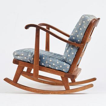 "Sportstugemöbel", a stained pine rocking chair, Nordiska Kompaniet Sweden 1930-40's.