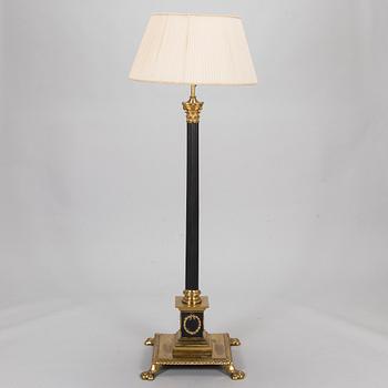 An empire style brass floor lamp, first half of the 20th Century.