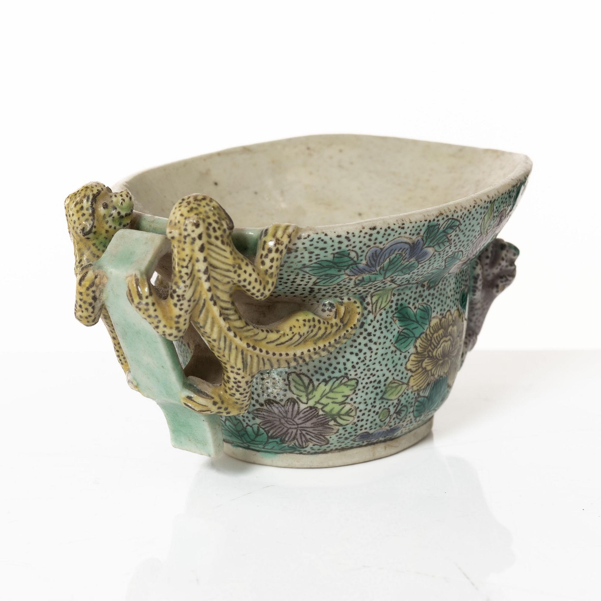 A famille verte bisquit wine cup, Qing dynasty, Kangxi (1662-1722).