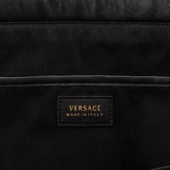 Versace, a black quilted leather handbag.