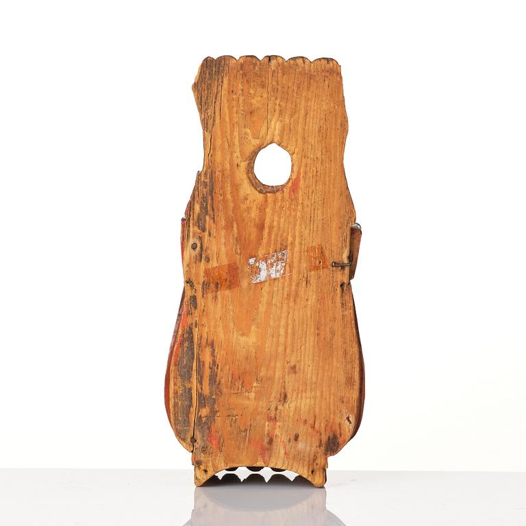 A Swedish folk art carved and painted spoon holder, 18th century.