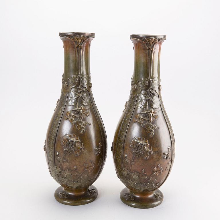 A pair of Japanese 20th century bronze vases.