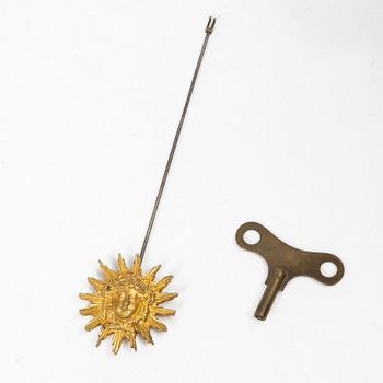 A Louis XVI-style mantle clock and a pair of candelabras. Early 20th century.