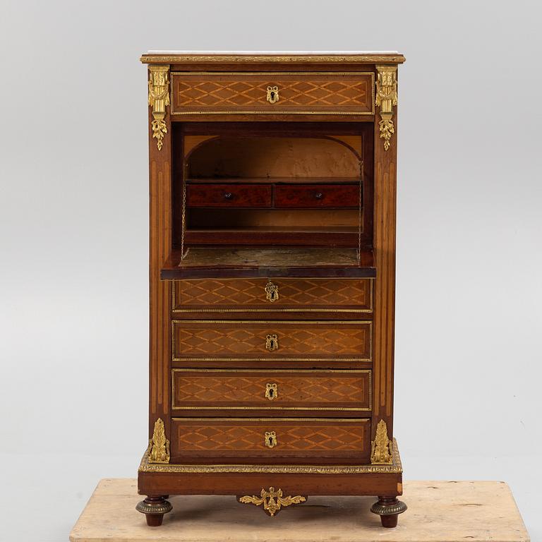 A Louis XVI-style chest of drawers, circa 1900.