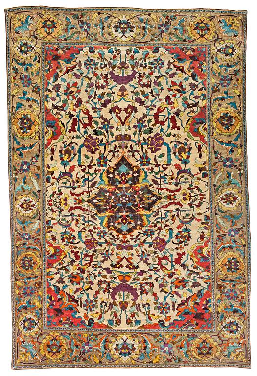 A RUG. An antique silk Kashan so called Motachem. 202,5 x 136,5 cm.