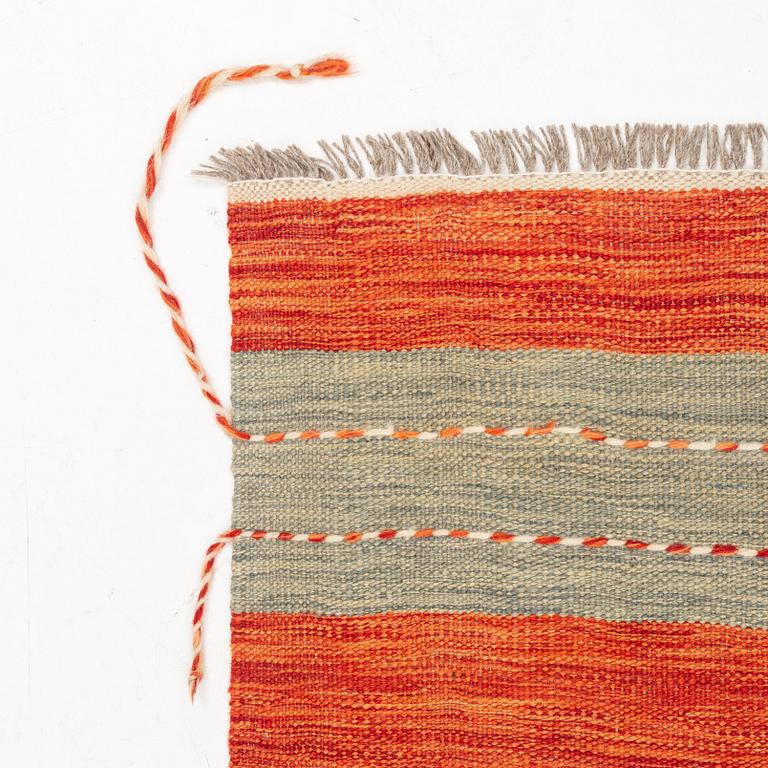 A Kilim rug, c. 245 x 170 cm.