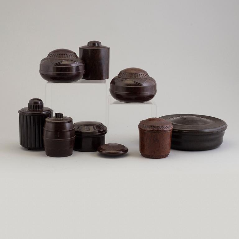 A set of nine swedish and english bakelite boxes, 1930's.