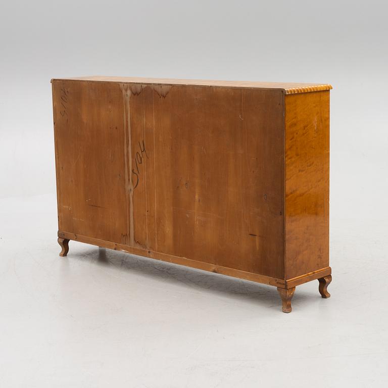 A bookcase with cabinet, 1940's.